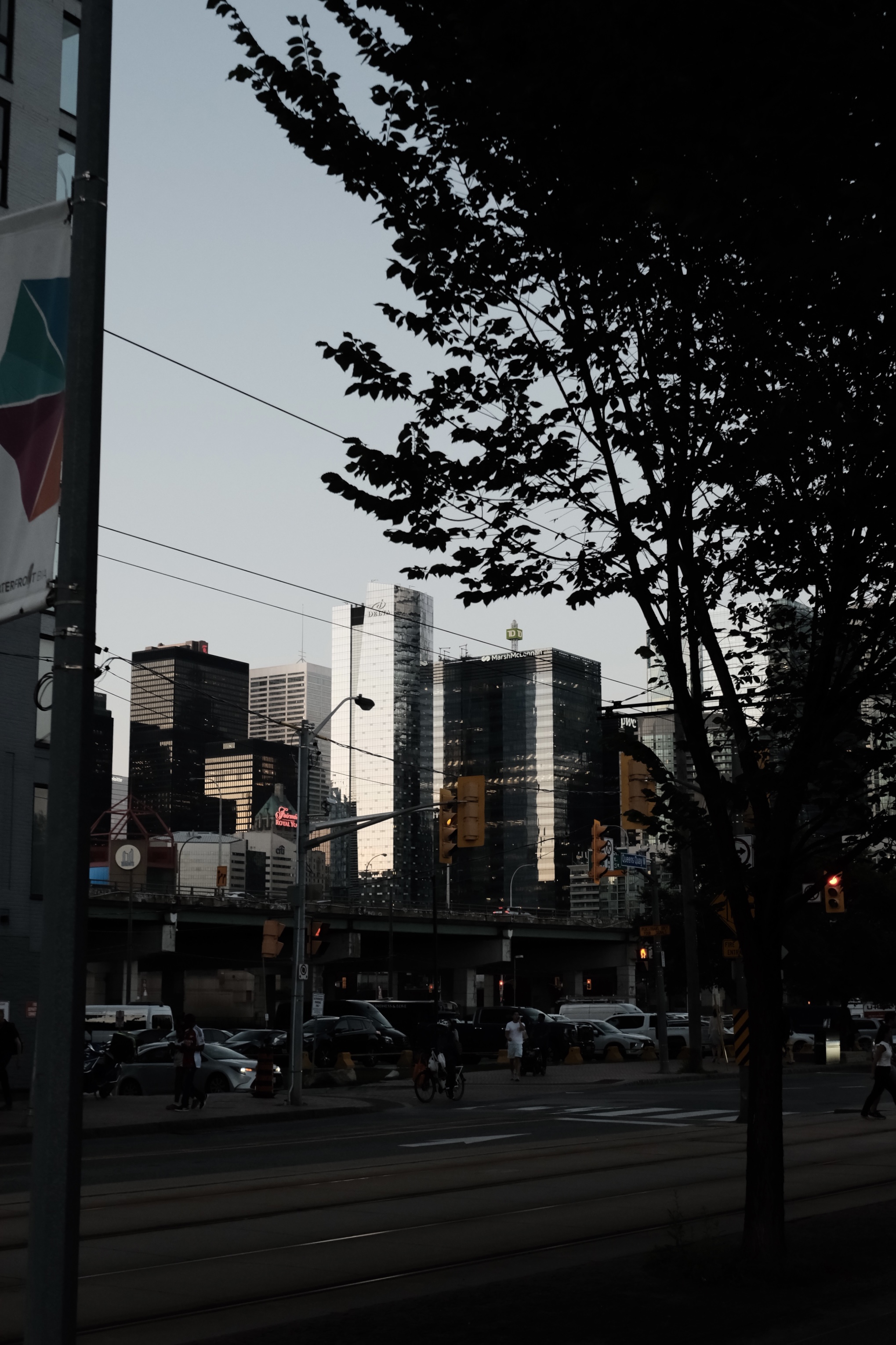 Toronto financial district skyline from a downtown street at dusk